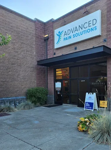 The entrance to Advanced Pain Solutions at 1020 SW Indian Ave, Redmond, with the APS sign above the door